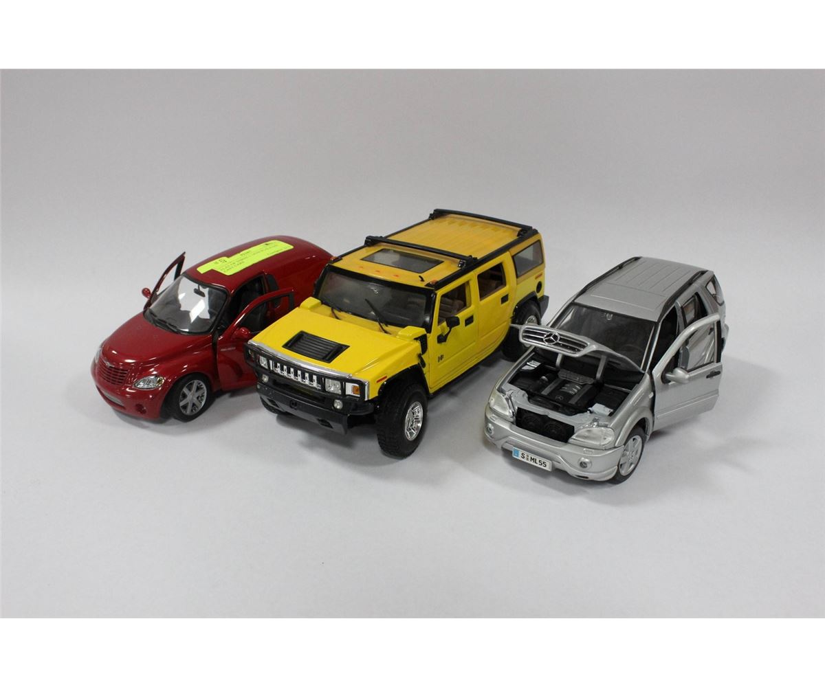 FLAT OF THREE 118TH SCALE DIE CAST CARS