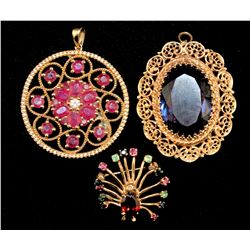 THREE GOLD & COLOURED STONE BROOCHES & PENDANTS