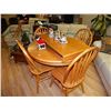 Image 1 : ROUND OAK TABLE WITH LEAF - AS-IS -  AND 4 CHAIRS