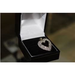 10KT YELLOW GOLD AND RHODIUM FINISH HEART SHAPED DIAMOND PENDANT WITH 42 TAPERED DIAMONDS, APPROX