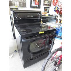 Black GE smooth top stove - used