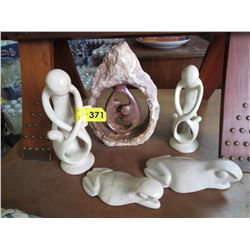 5 Carved stone statues