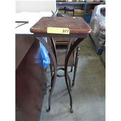 Plant stand with wrought iron legs
