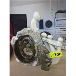5 Carved stone statues