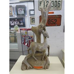 Vintage wood carving of a deer