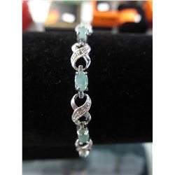 5.5 CTW Diamond & Emerald tennis bracelet