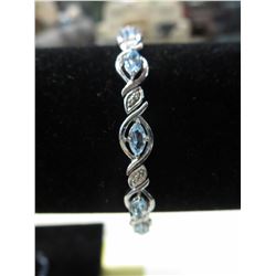 Blue Topaz & Diamond 6.50 CT tennis bracelet