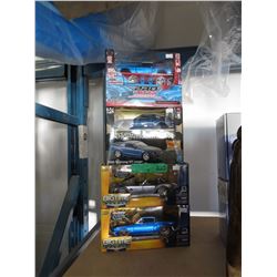 4 Scale model cars in original boxes