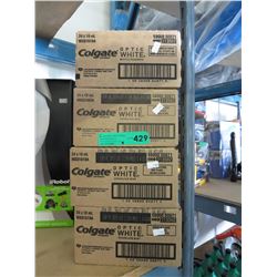 4 x Boxes of Colgate travel size toothpaste.