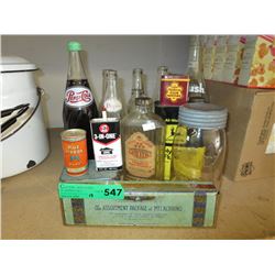 Collection of vintage containers with advertising