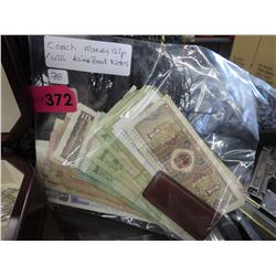 Leather "Coach" money clip with Asian bank notes