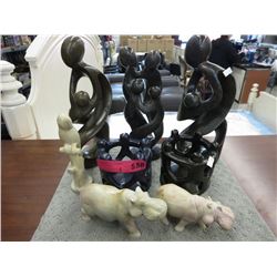 8 Carved stone statues
