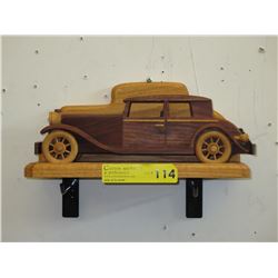 Wood model of vintage car on display