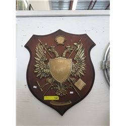 Wood wall shield with plastic heraldic emblem