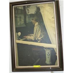Framed print on board of a woman playing the piano
