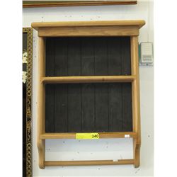 Wood bathroom cabinet with towel rack.