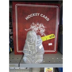 Carved Inuit statue & book of hockey cards