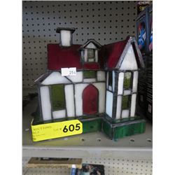 Stained glass lamp shaped like a house
