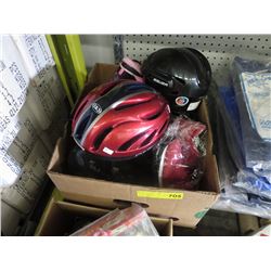 Box of new shoes & 2 used helmets.
