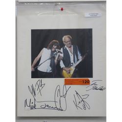 Autographed concert photo - Foreigner