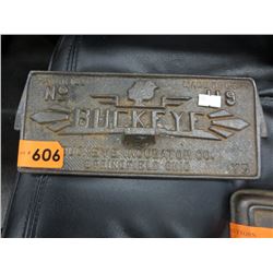 Cast metal Buckeye  stove door plate
