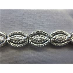 Diamond studded scallop design tennis bracelet