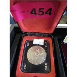 1973 Canadian RCMP dollar in case.