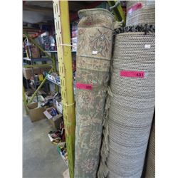 Used area carpet - predominately green