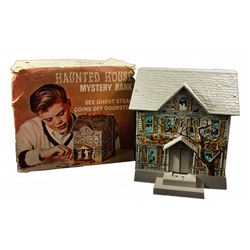 Haunted house tin litho toy.