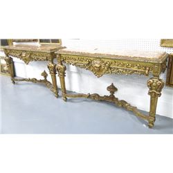Pair of marble top giltwood figural consoles