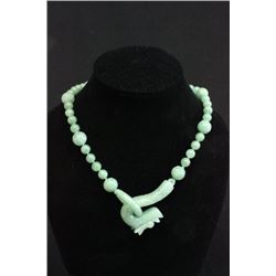 Green jade beaded necklace with "Dragon" carving