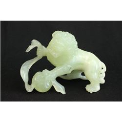 Green stone "Lion Fighting Snake"