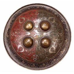 AN INDIAN BRASS BUCKLER SHIELD