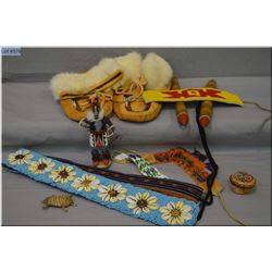 Selection of leather and bead work including moccasins, shell motif belt,  small bands etc.
