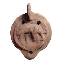 A Roman ceramic lamp with an elephant