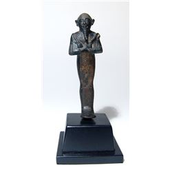 An Egyptian bronze figure of Osiris