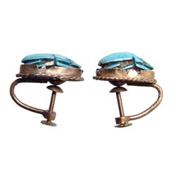 A pair of turquoise glazed scarab earrings