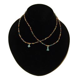 Egyptian faience bead necklaces with floral pendants