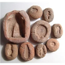 9 New Kingdom terracotta amulet molds