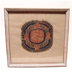 A framed Coptic textile fragment