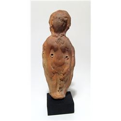 A molded terracotta female votive figure