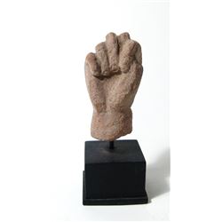 Egyptian terracotta fist from a larger figure