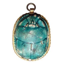 A superb Egyptian scarab set into a gold pendant