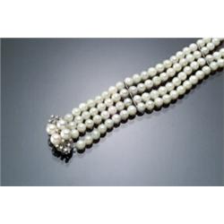 Cultured Pearl and Diamond Cocktail Bracelet Having four individual strands of one...