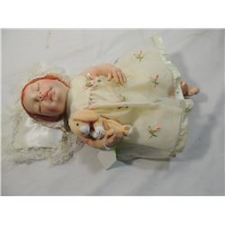 HARD VINYL SLEEPING NUMBERED DOLL