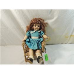 VINTAGE HARD PLASTIC DOLL IN WICKER CHAIR