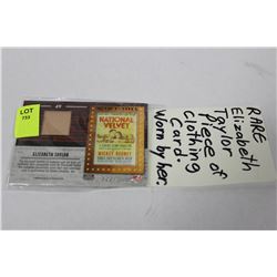 PIECE OF CLOTHING IN CARD  WORN BY