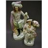 Image 1 : A STAFFORDSHIRE FLATBACK FIGURE, 19th Century, young man wearing sporran and carrying grapes in a...