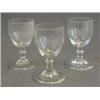 Image 1 : A SET OF THREE WINES, c.1820, barrel bowls, knopped stems on folded feet, height 10cm (3)  30-50...