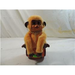 BATTERY OPERATED MONKEY ON BARREL